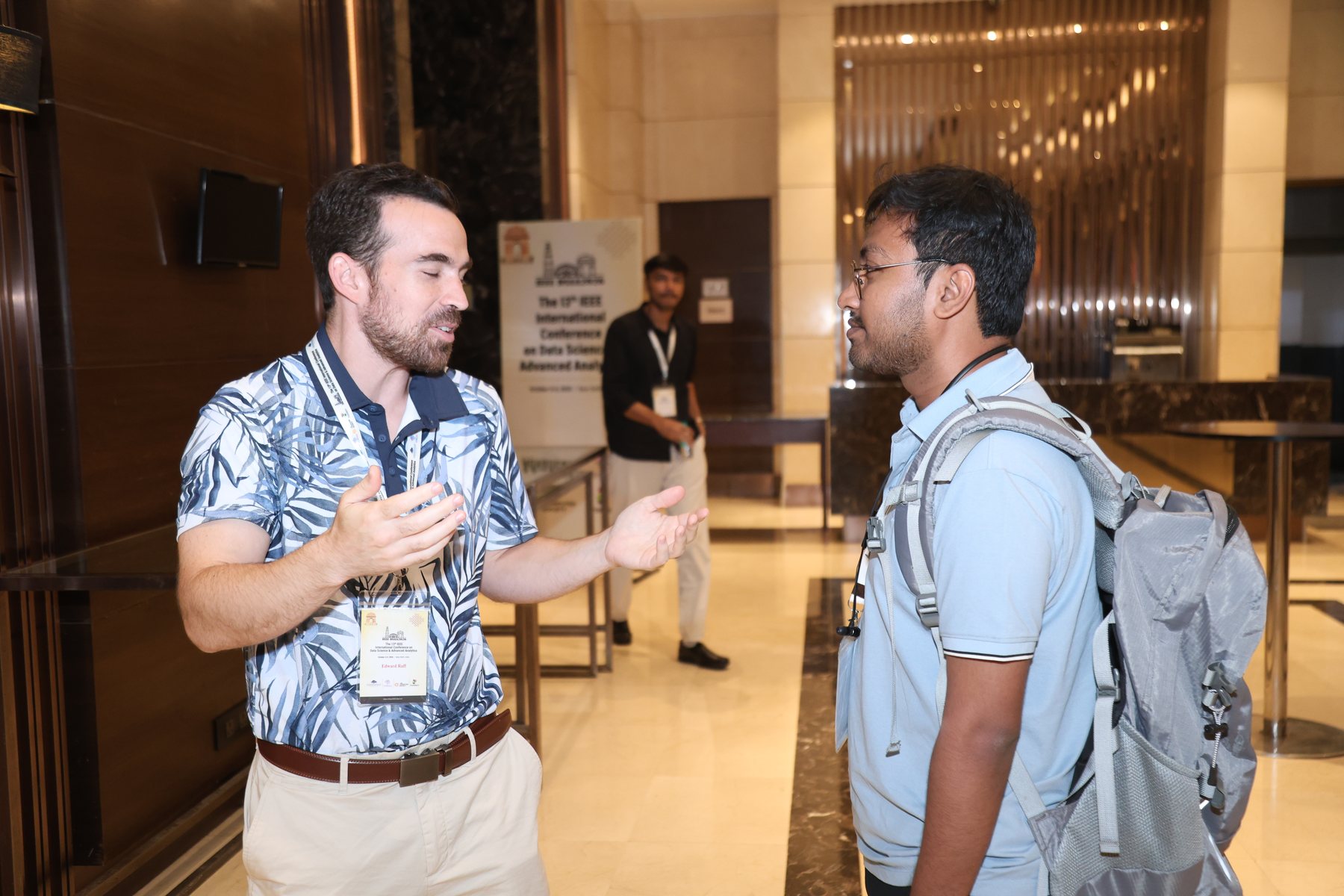 M Mohaiminul Islam speaking with a fellow attendee at DSAA 2026
